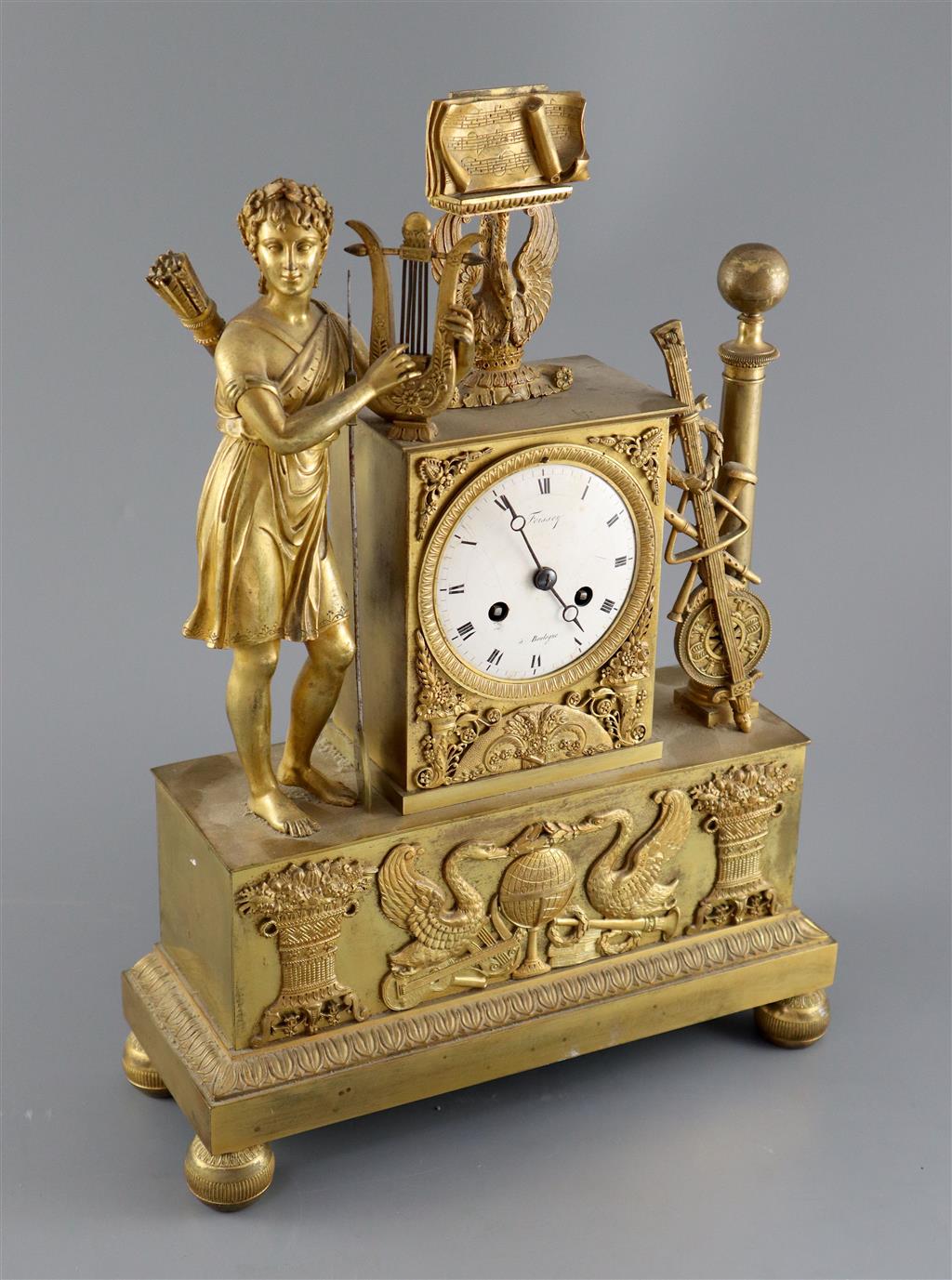 A 19th Century French Empire style ormolu mantel clock, height 15in.